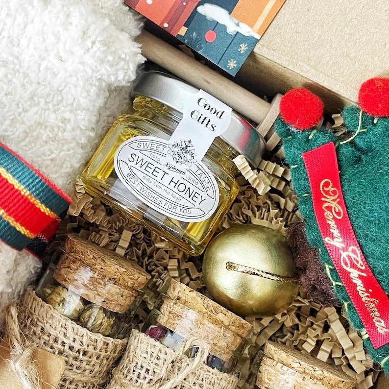 3. Christmas Tea & Cozy Gift Box – Socks, Honey, Herbal Tea, Chocolates & Ornament