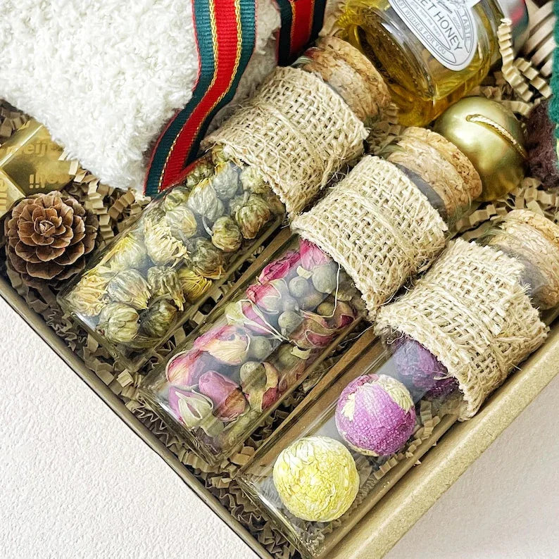 3. Christmas Tea & Cozy Gift Box – Socks, Honey, Herbal Tea, Chocolates & Ornament