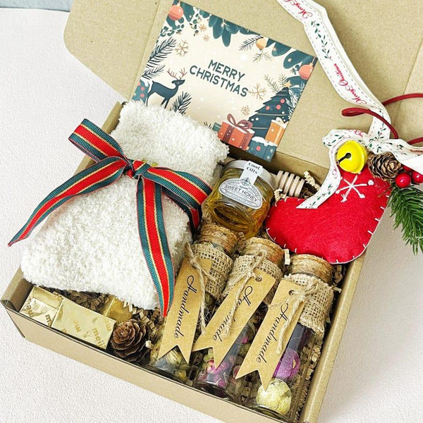 3. Christmas Tea & Cozy Gift Box – Socks, Honey, Herbal Tea, Chocolates & Ornament