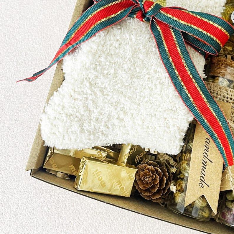 3. Christmas Tea & Cozy Gift Box – Socks, Honey, Herbal Tea, Chocolates & Ornament